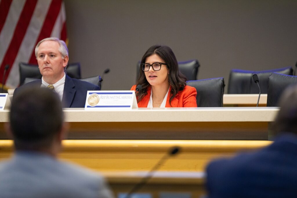 Shot of State Rep. Demi Busatta, R-Coral Gables, speaking from a dais.