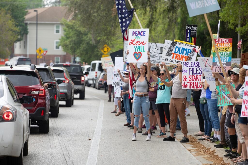 No Kings protesters line Southwest Sixth Street beside Cora P. Roberson Park in Gainesville on Saturday to oppose President Donald Trump’s policies related to immigration, war and the economy. Similar events took place in cities across the country and abroad.