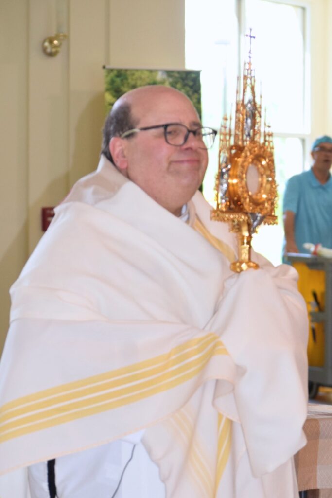 Queen of Peace Catholic Community pastor Father Alberto Esposito will perform Mozart's Requiem on the violin. Courtesy Queen of Peace Catholic Community