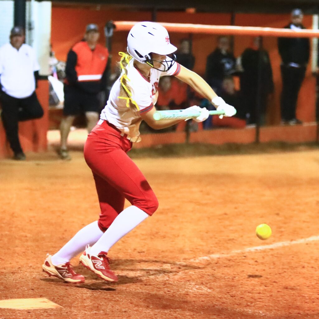 Santa Fe's Callie Blair (3) lays down a bunt in the top of the ninth inning against Trenton. Photo by C.J. Gish