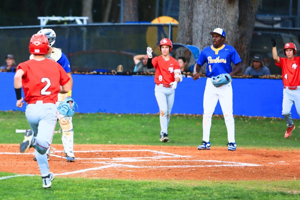 Santa Fe's Will Beck (2) ties the game 2-2 in the top of the second inning against Newberry. Photo by C.J. Gish