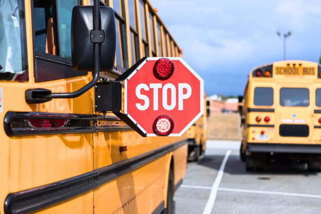 School bus stop sign on.
