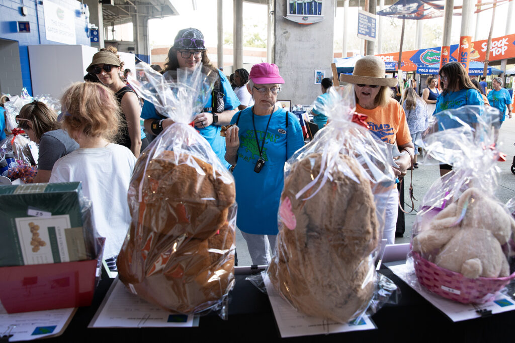 Stomp the Swamp participants peruse silent auction items after exploring Ben Hill Griffin stadium. Photo by Megan V. Wilsow
