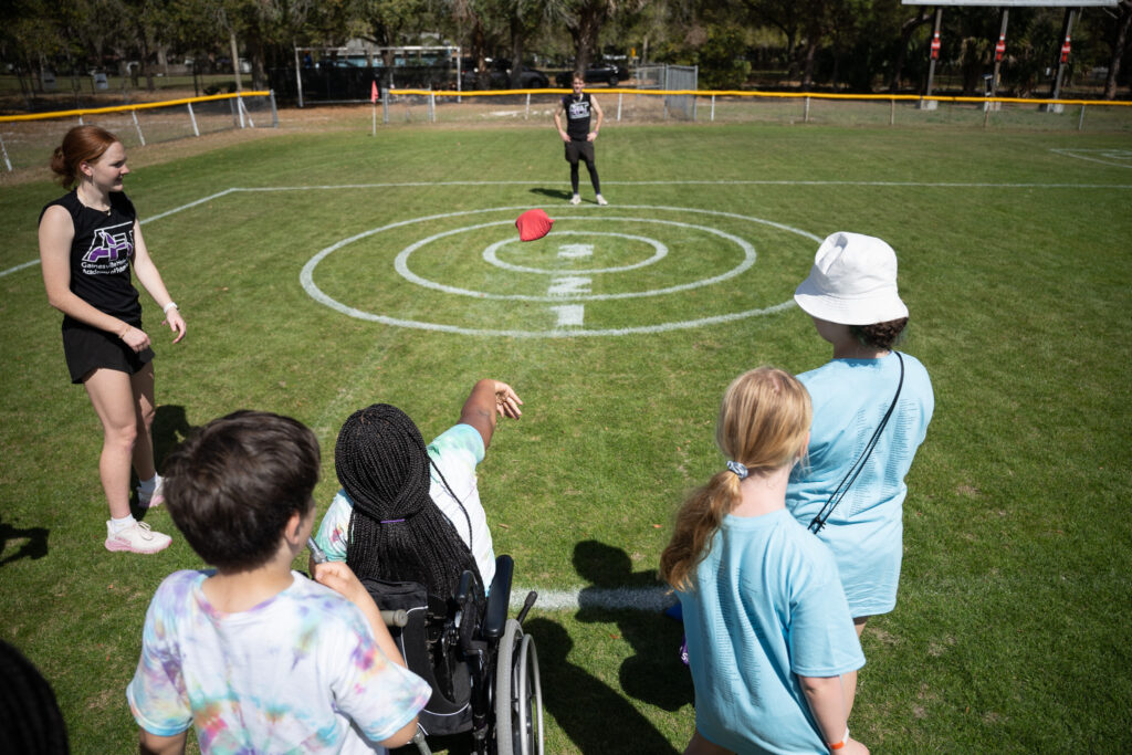 Students toss bean bags at Citizens Field. 1