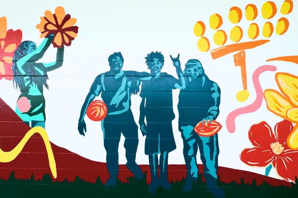 The Eastside High School mural includes images of athletes. Courtesy of Jenna Horner Art