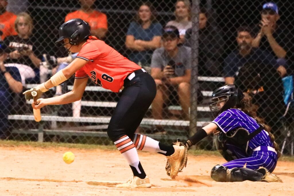 Trenton's Montana Moen (8) attempts a hit in the fifth inning against Gainesville. Photo by C.J. Gish