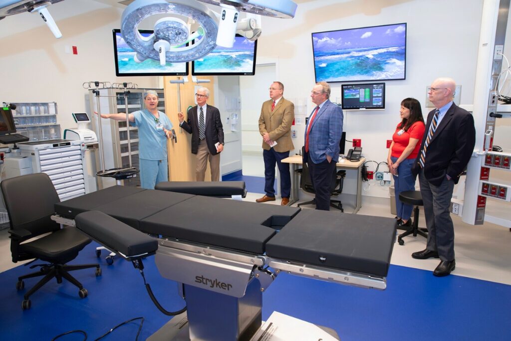 UF Health surgical technician Stephanie Hylton, an instrument specialist, describes the features of an operating room. Photo by Megan V. Winslow