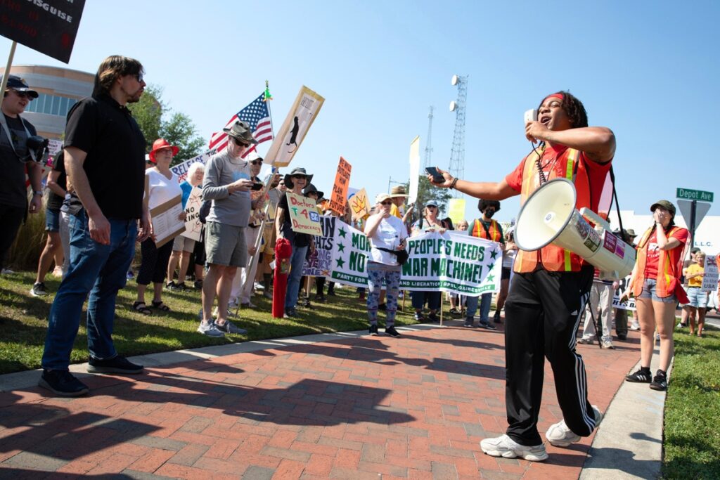 UF graduate student Kai Blades, an organizer for the Party for Socialism and Liberation and Students for Socialism, leads a crowd in chants Saturday as part of the No Kings protest in Gainesville.