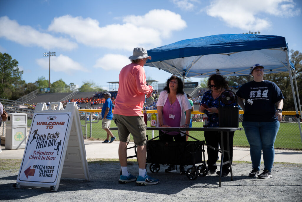 Volunteers checking in at the Fifth Grade Field Day.