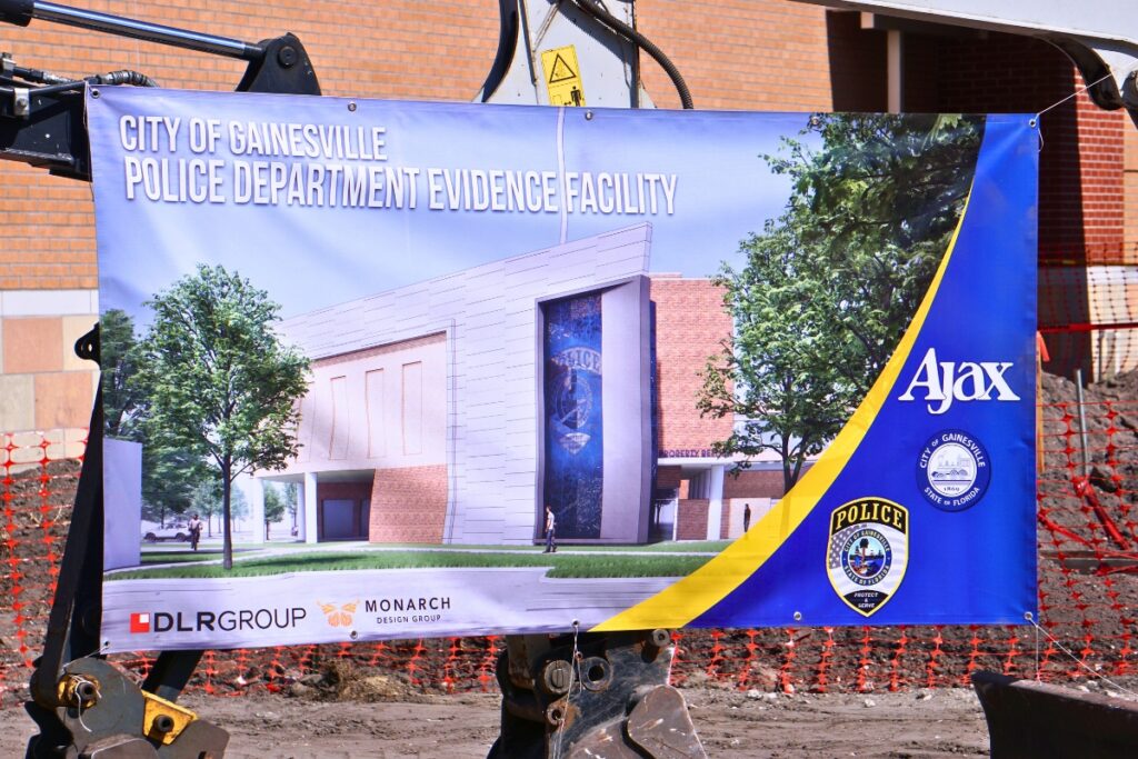 A rendering of the new GPD evidence facility hangs at its groundbreaking ceremony. Photo by Kirsten Rabin