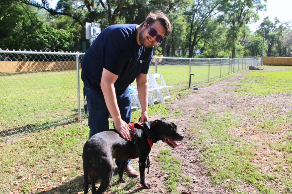 Assistant City Manager Dallas Lee and dog, Cairo, take a break from City Hall to enjoy the new Central Bark. Photo by Lillian Hamman