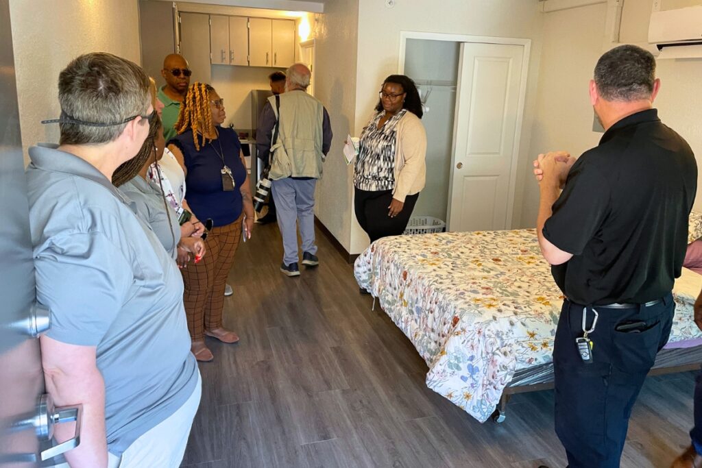 Attendees walk through a studio example at Forest Edge