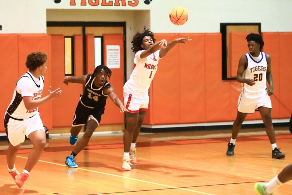 Baker County's Jamarion Goodman (1) passes the ball downcourt at The Prep Zone All-Star Showcase on Saturday. Photo by C.J. Gish