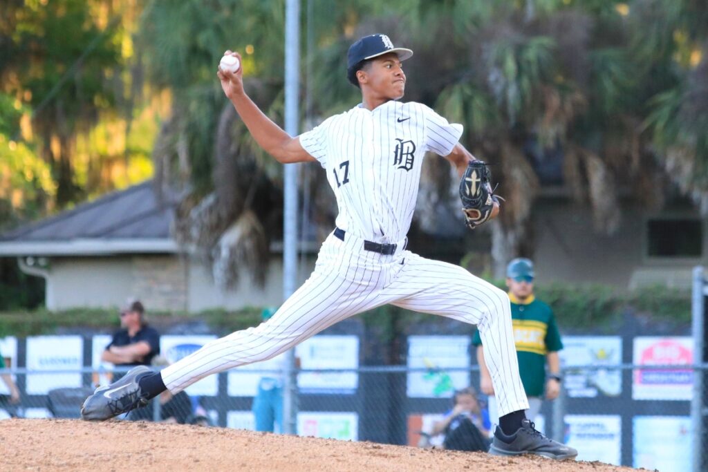 Bobcat pitcher Dion Wilburn led Buchholz from the mound. Photo by Seth Johnson