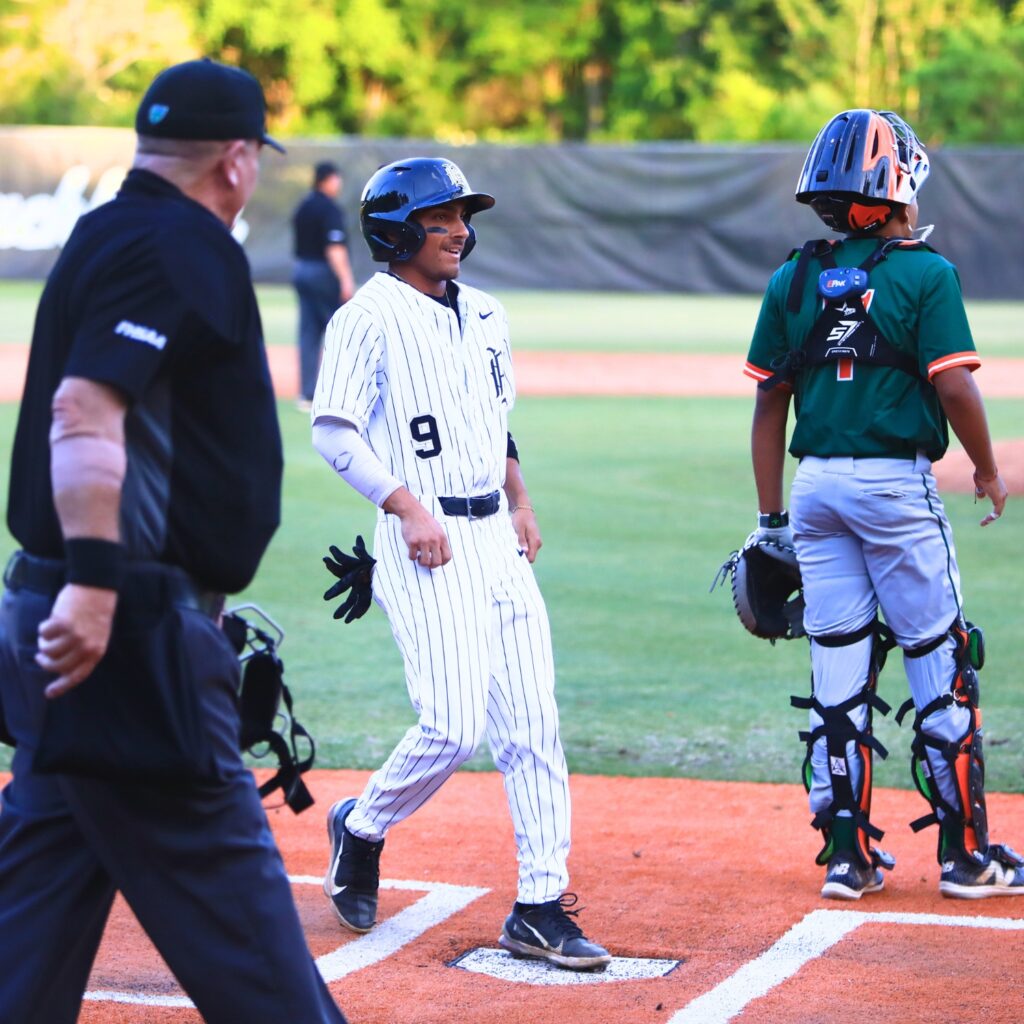 Buchholz's Angel Irizarry (9) scores for a 6-2 lead in the bottom of the first inning gainst Mandarin (Jacksonville) in the 6A-Region 1 Quarterfinals. Photo by C.J. Gish