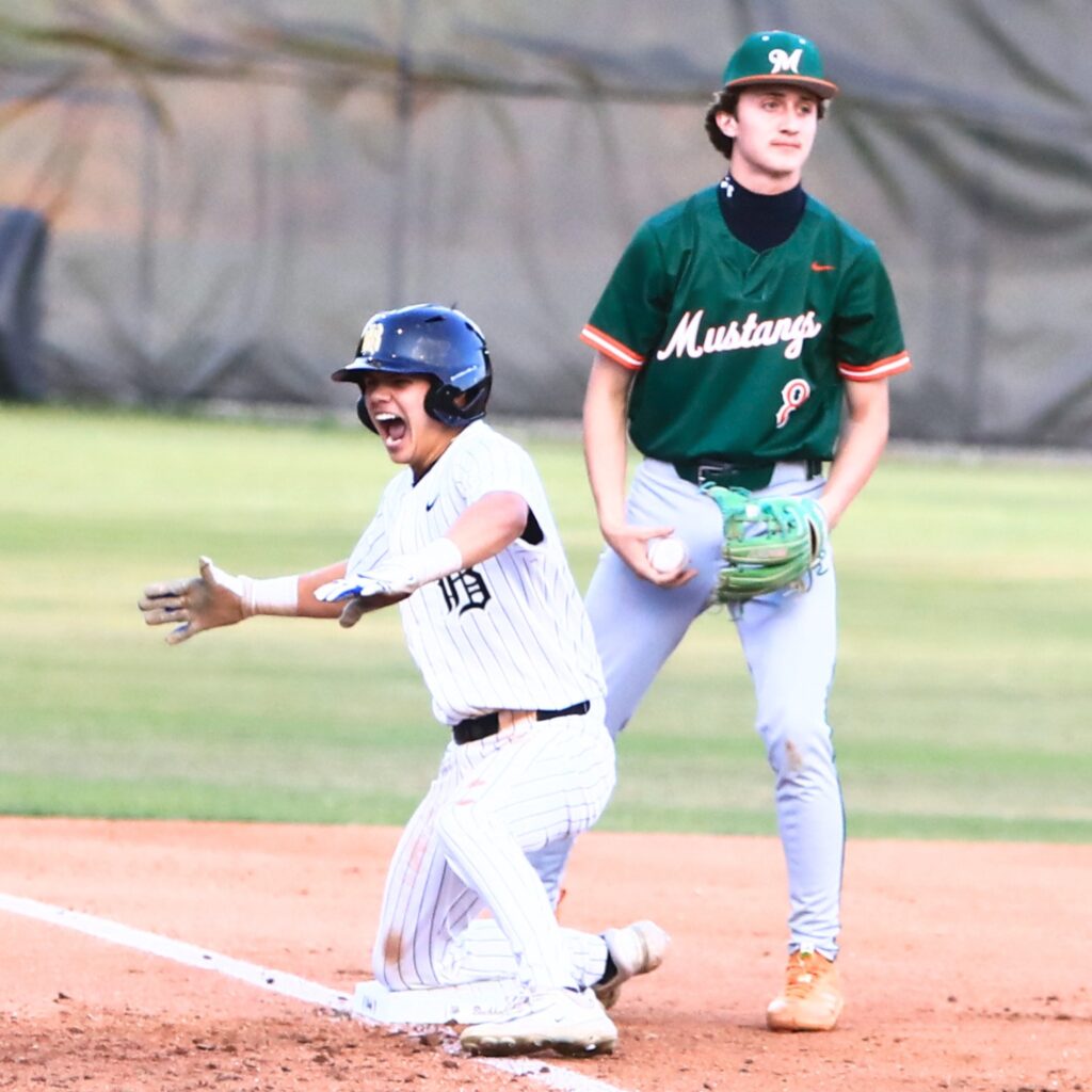 Buchholz's Antoine Deleyrolle (23) all smiles after hitting a one-run triple for a 6-2 lead in the bottom of the first inning against Mandarin (Jacksonville) in the 6A-Region 1 Quarterfinals.