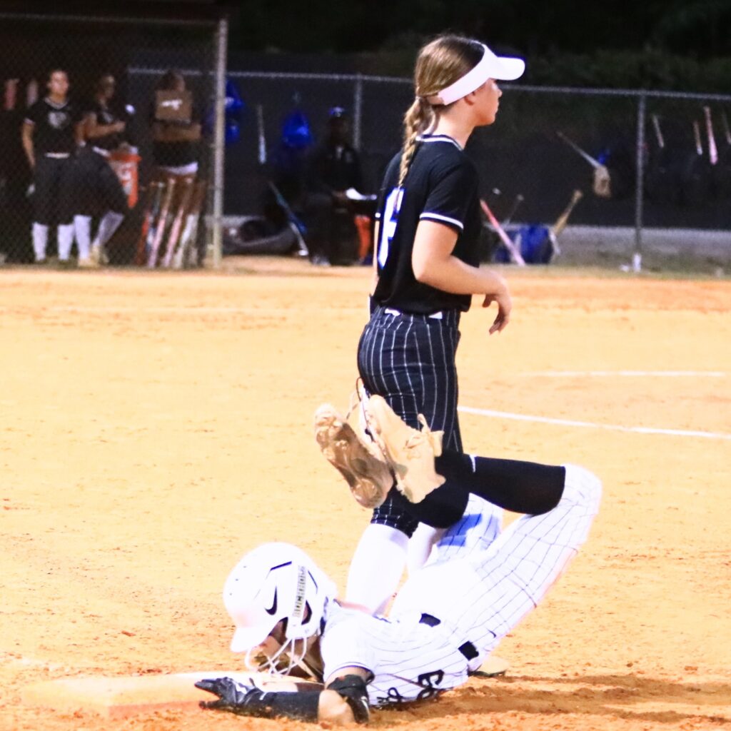 Buchholz's Grace Lariz-McDaniel (99) gets back to first base in time after hitting a single in the fourth inning against Bartram Trail (St. Johns) in the 6A-District 3 Semifinals. Photo by C.J. Gish