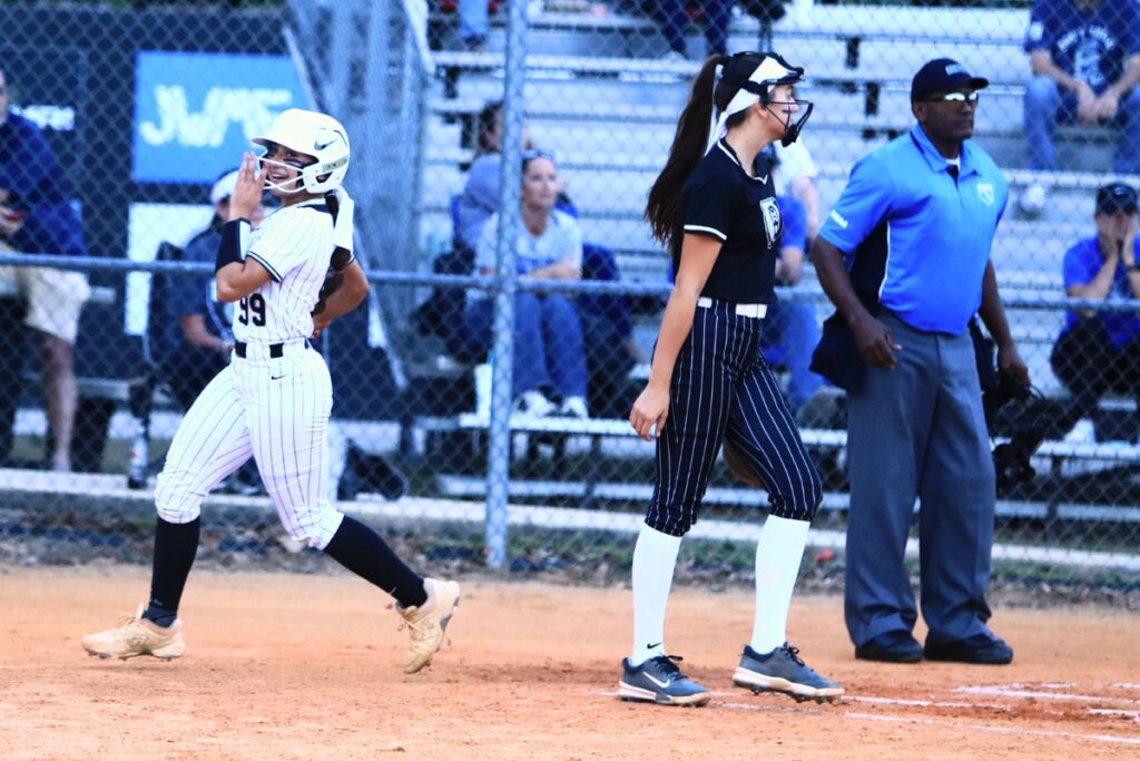 Buchholz's Grace Lariz-McDaniel (99) scores in the bottom of the first inning to tie the game 1-1 against Bartram Trail (St. Johns) in the 6A-District 3 Semifinals. Photo by C.J. Gish