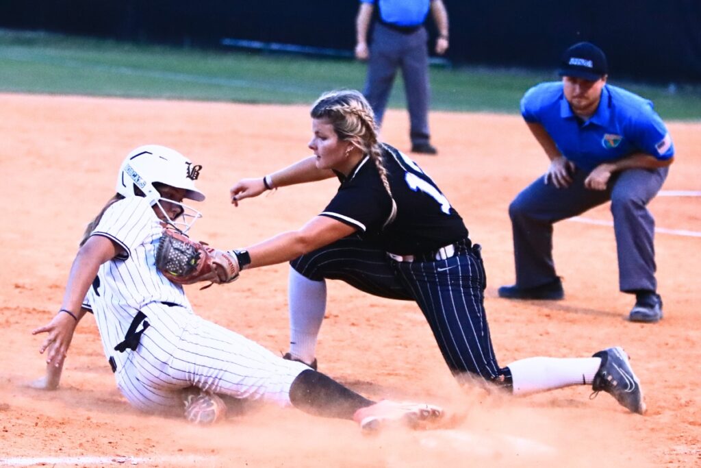 Buchholz's Jade Seabrook (6) slides safely into third base in the third inning against Bartram Trail (St. Johns) in the 6A-District 3 Semifinals. Photo by C.J. Gish