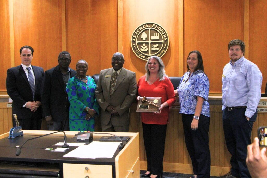 City officials present Dayna Williams (second from right) with an award recognizing her service as commissioner and vice mayor. Photo by Lillian Hamman