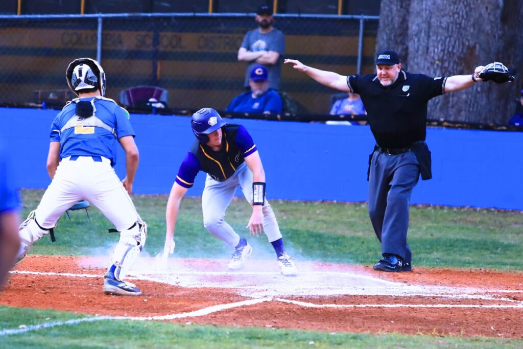 Columbia's Tison McCray (9) scores for a 1-0 Tigers' lead after running home following two throwing errors at Newberry. Photo by C.J. Gish