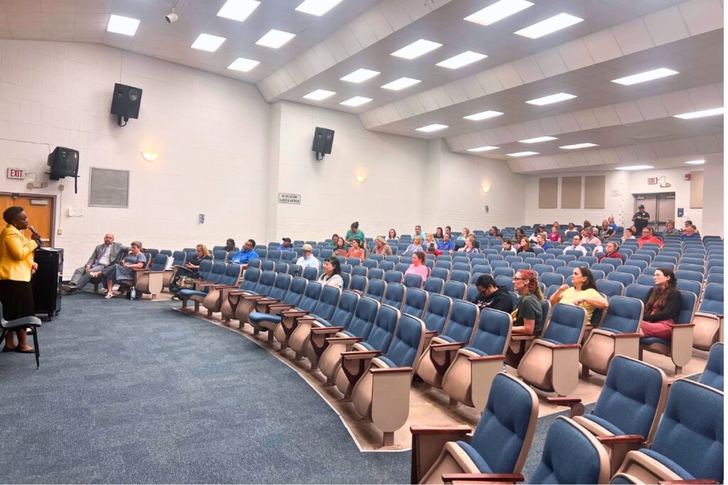 Community members gathered in the Mebane Middle School Auditorium for a meeting focused on the future of several public schools in the city of Alachua. Photo by Nick Anschultz
