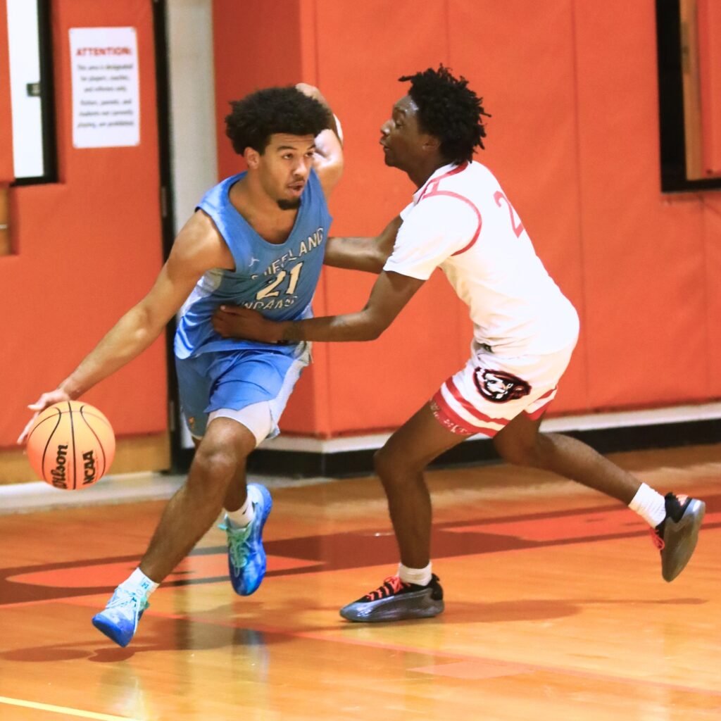 Fort White's Desean Lally (2) tries to slow down Chiefland's Jon Adams (21) at The Prep Zone All-Star Showcase on Saturday. Photo by C.J. Gish