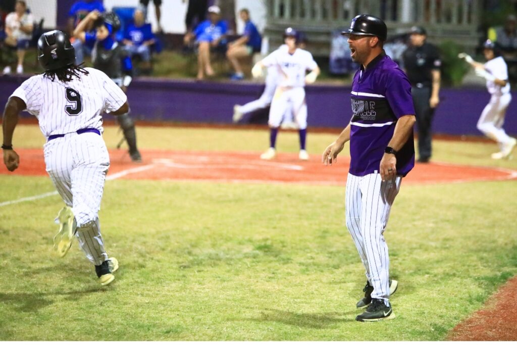 Gainesville coach Adrian Ramos waves in Micaiah Hill (9) to tie the game 3-3 against Belleview in a Class 5A-District 5 semifinal. Photo by C.J. Gish