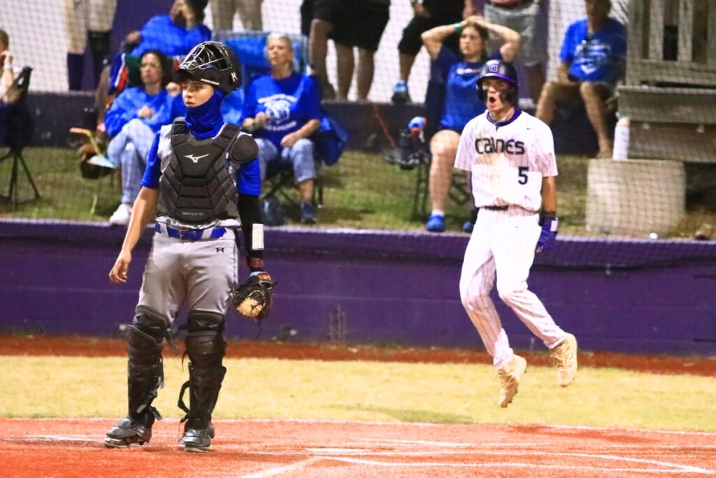 Gainesville's Ty Quinn (5) scores in the bottom of the sixth inning for a 5-3 lead against Belleview in a Class 5A-District 5 semifinal. Photo by C.J. Gish