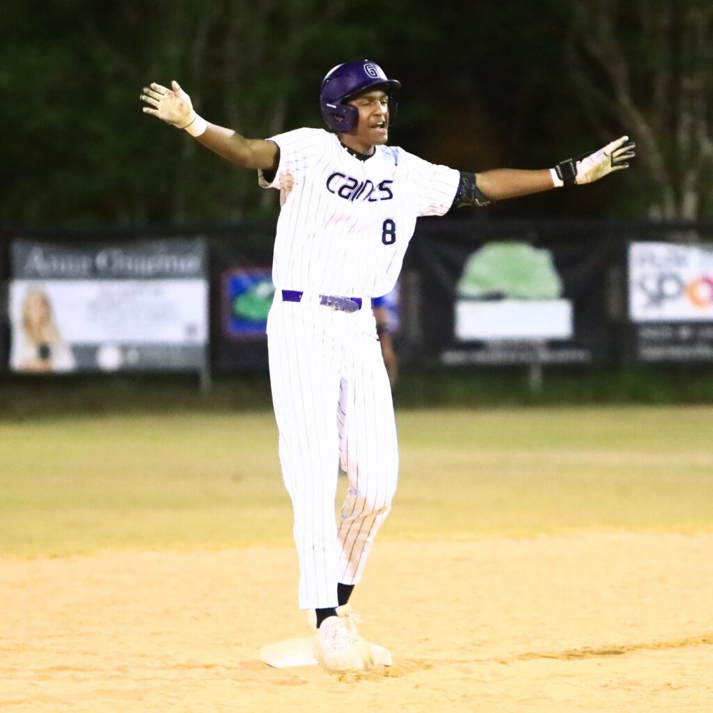 Gainesville's Yunel Rojas (8) celebrates after hitting a three-run double to tie the game 3-3 against Belleview in a Class 5A-District 5 semifinal. Photo by C.J. Gish
