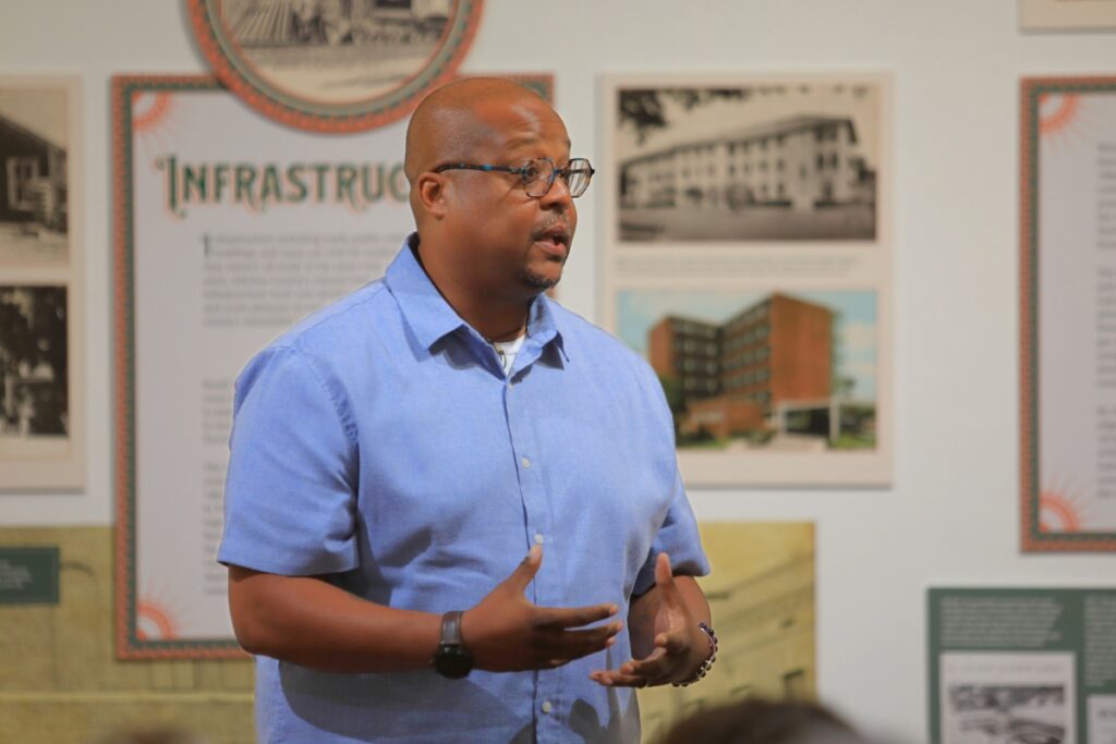 Nashid Madyun, executive director of Florida Humanities, introduces the audience to the nonprofit's mission