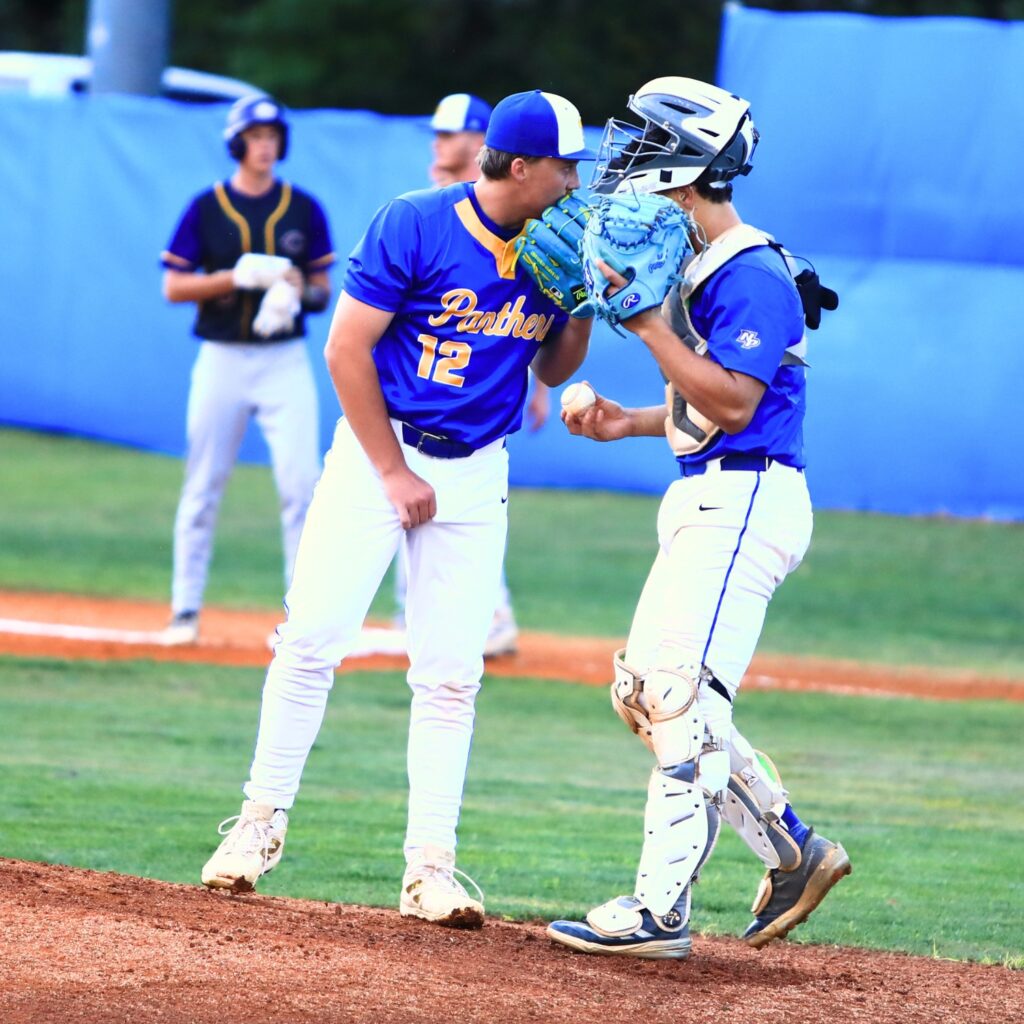 Newberry pitcher Brantley McCoy (12) talks with catcher Aiden Michaux (2) in the second inning. Photo by C.J. Gish