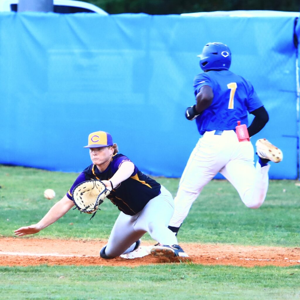 Newberry's Desmond Taylor (1) beats the throw to first base in the bottom of the first inning against Columbia. Photo by C.J. Gish