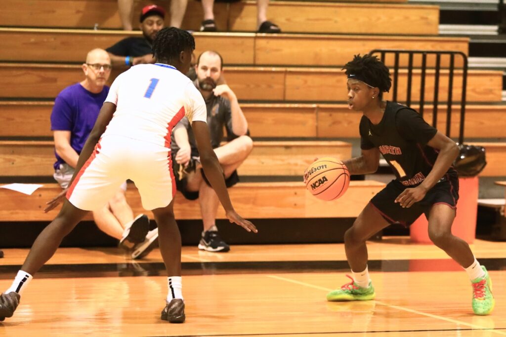 North Marion's Tekelvin Jackson brings the ball downcourt at The Prep Zone All-Star Showcase on Saturday. Photo by C.J. Gish