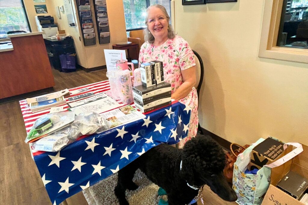 Paula Sarah Dempsey with her sugar dog, Sophie. Photo by Ronnie Lovler