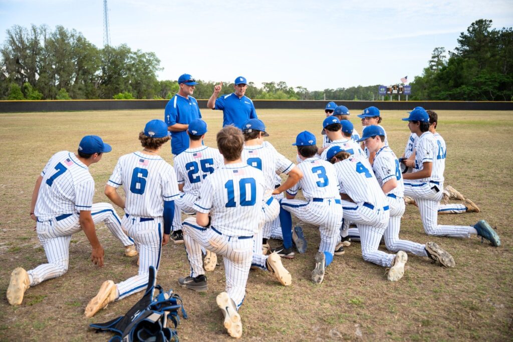 Saint Francis Catholic coaches talk to team after beating Lake Mary Prep in the 1A-Region 2 Quarterfinals. Photo by Tim Rodriquez