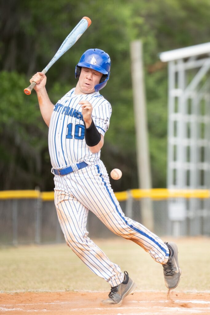 Saint Francis Catholic's Chris Durstine (10) gets hit by a pitch against Lake Mary Prep in the 1A-Region 2 Quarterfinals. Photo by Tim Rodriquez
