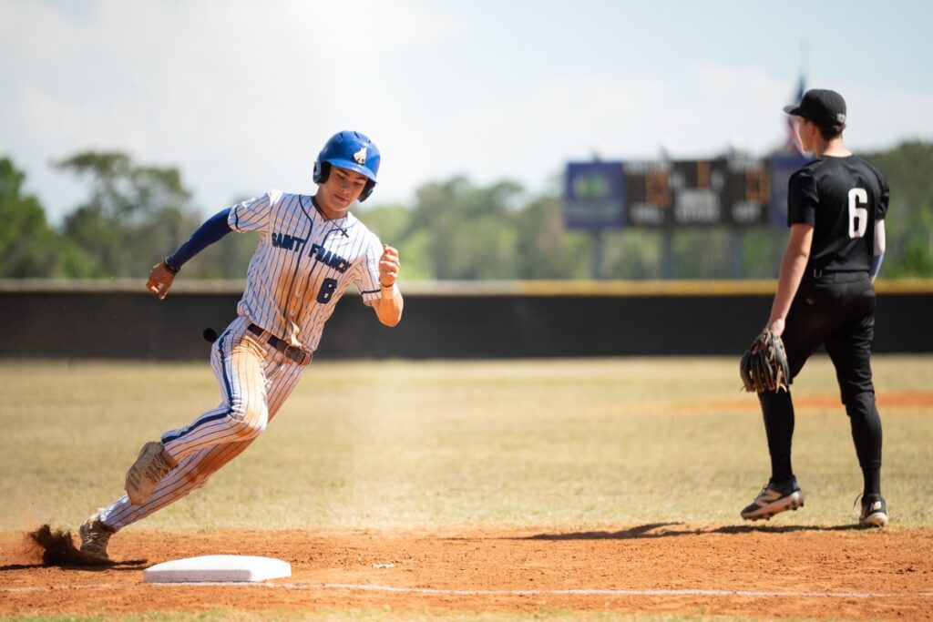 Saint Francis Catholic's Sawyer Williams rounds third base in the first inning against Lake Mary Prep in the 1A-Region 2 Quarterfinals. Photo by Tim Rodriquez