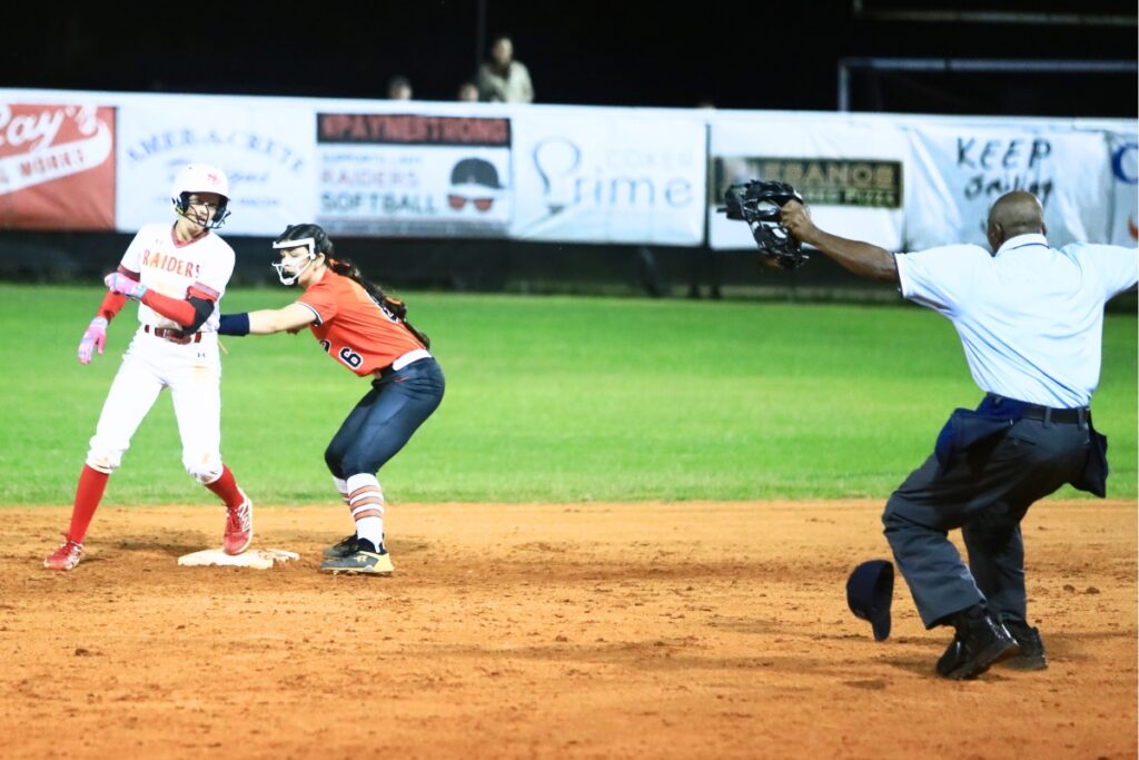 Santa Fe's Corie Wheeler (8) beats a tag by Trenton's Emaleigh Philmon (2) for a double in the bottom of the fourth inning. Photo by C.J. Gish