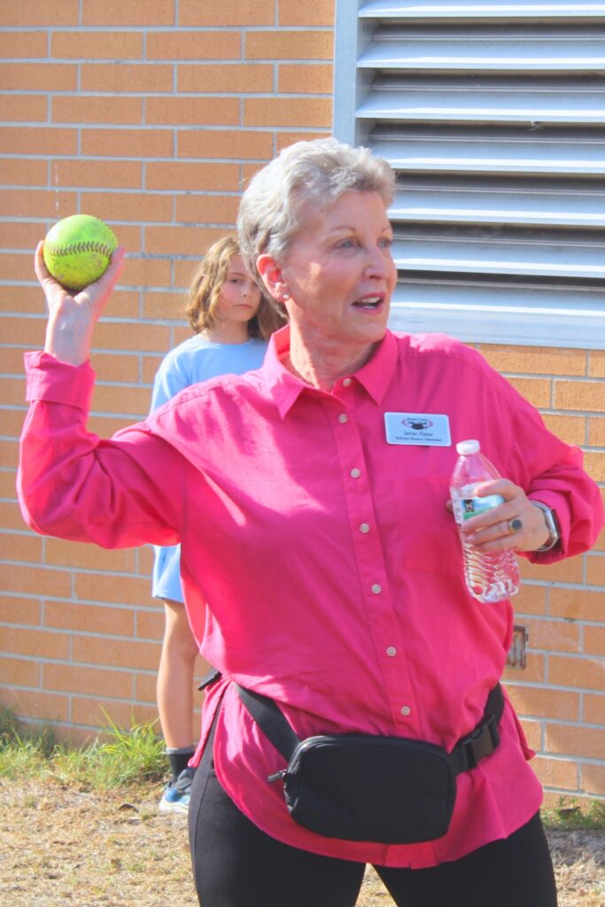 School Board of Alachua County Member Janine Plavac throws a ball at the dunk tank. Photo by Nick Anschultz