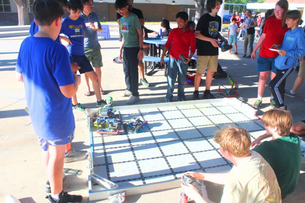 Students went head-to-head in a robotics competition outside. Photo by Nick Anschultz