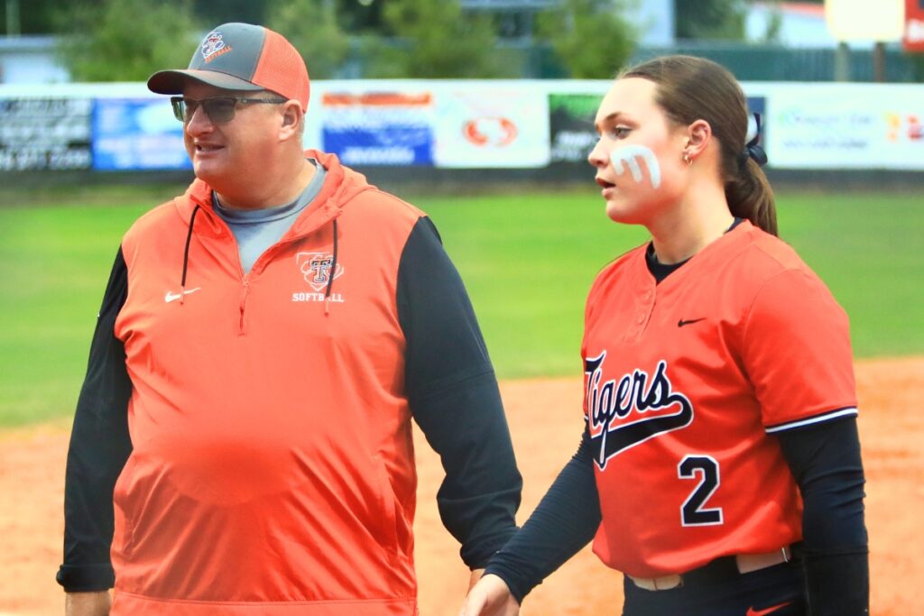 Trenton softball coach Kevin Benson (left) with Addison Allaire. Photo by C.J. Gish