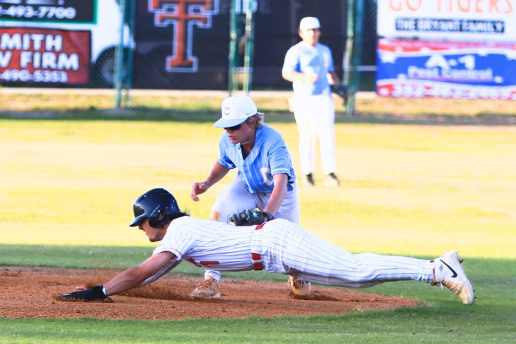 Trenton's Brant Bivens gets caught by Chiefland's Levi Coe in the bottom of the first inning of the Rural-District 7 semifinals. Photo by C.J. Gish