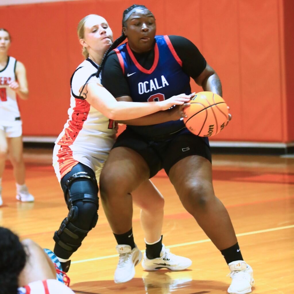 Trenton's Kayley Sloan goes after the ball against Ocala's Sanaria Gunsby in The Prep Zone All-Star Showcase. Photo by C.J. Gish