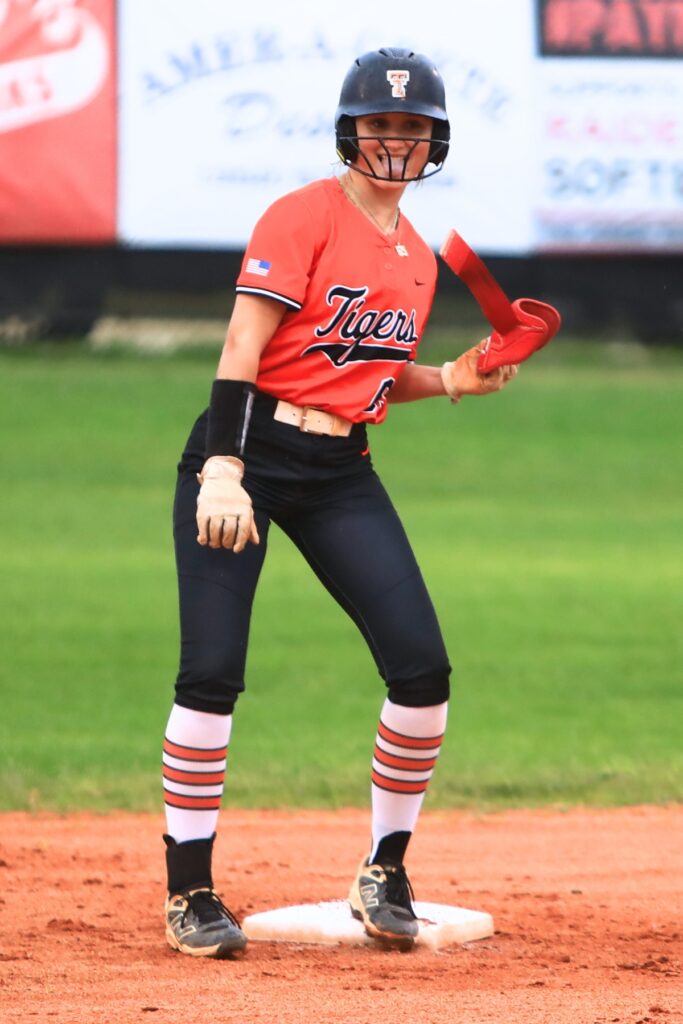 Trenton's MacKenzie Fisher (65) with a celebration dance after hitting an RBI double in the top of the first inning for a 1-0 lead at Santa Fe. Photo by C.J. Gish