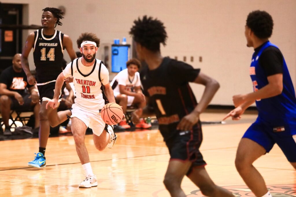 Trenton's Nathan Ridgell (11) brings the ball downcourt at The Prep Zone All-Star Showcase on Saturday. Photo by C.J. Gish