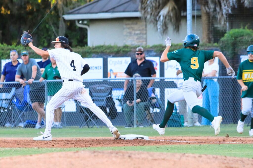 Zac Brown gets an out at first for Buchholz following a diving catch from shortstop Hudson Sapp. Photo by Seth Johnson