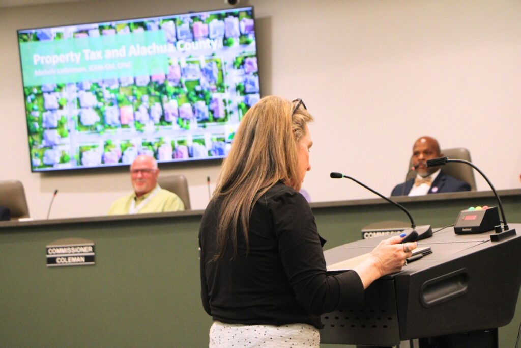 Alachua County Manager Michele Lieberman presented possible outcomes of a state bill that could eliminate property taxes. Photo by Lillian Hamman
