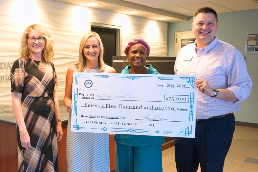 Community Foundation's President Barzella Pap (left) and chair Ester Tibbs (second from right) with GACAR chair Kacey Anderson (second from left) and GACAR founder Adam Gurske.