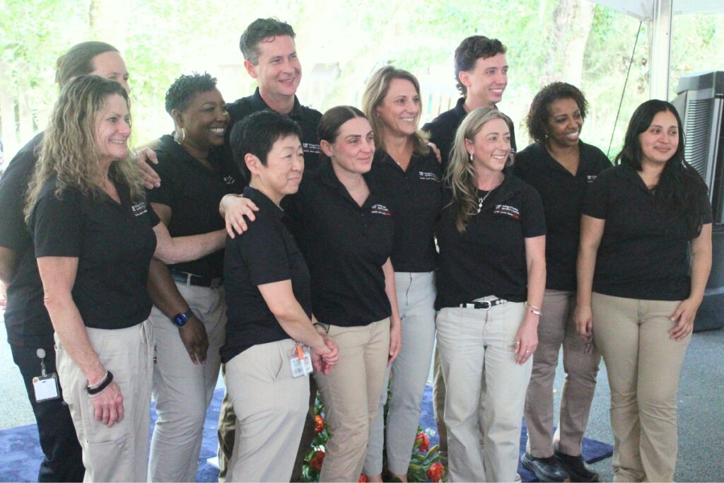 Current staff at UF Health Archer Family Health Care pose for a group photo. Photo by Nick Anschultz